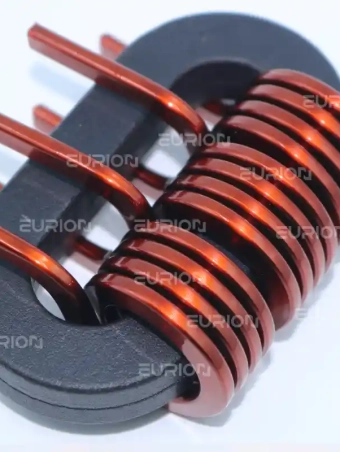 Large power inductor coil formed by the EC-680 edgewise winding machine for high-current applications.